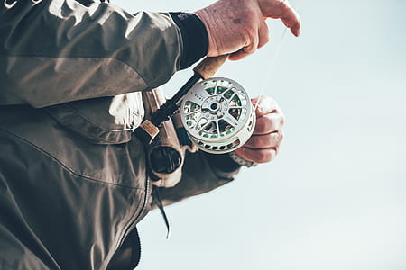 man holding fishing rod thumbnail