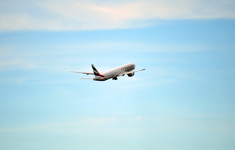 white and red airplane at the sky during daytime thumbnail