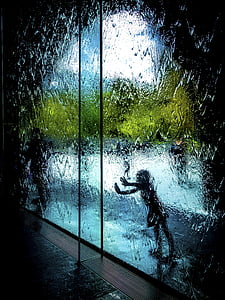 person behind glass wall painting thumbnail