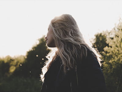 Woman Standing on Green Grass thumbnail