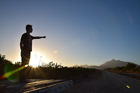man standing during sunset thumbnail