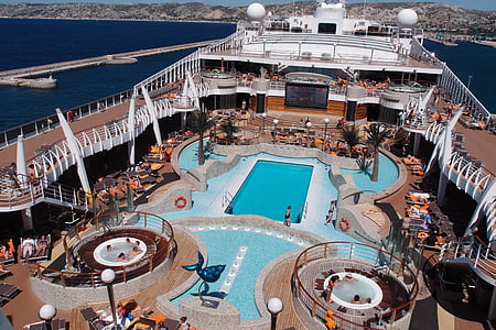 people on cruise ship with swimming pool during daytime thumbnail