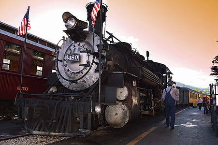 person walking beside train station thumbnail