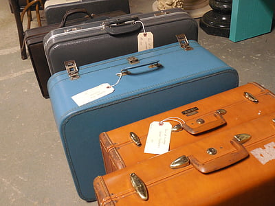 suitcases on concrete floor thumbnail