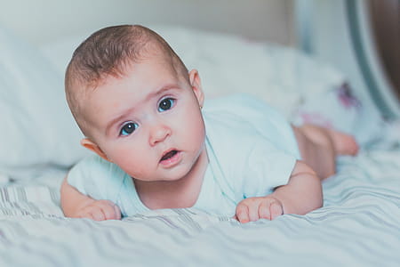 Baby Lying on Bed thumbnail