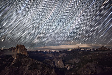 time lapse of brown mountain with a scene of meteorites thumbnail