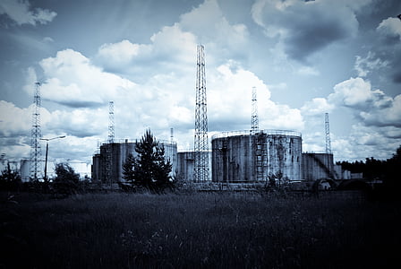 gray metal water tank site under white and blue sky thumbnail
