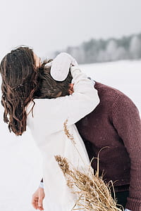 Woman Hugging Man in Black Sweatshirt thumbnail