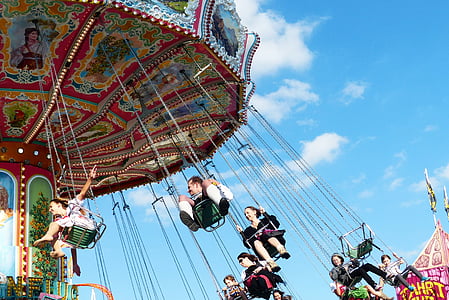 several people riding Mary go round thumbnail