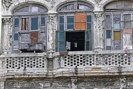 white apparel hanged on clothesline inside building thumbnail