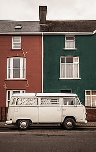 classic white van parked near house thumbnail