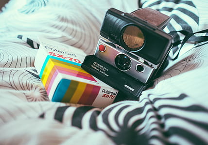 instant camera on bed thumbnail