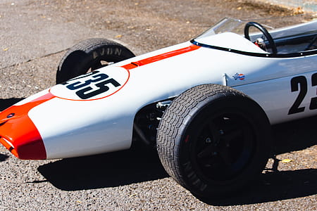 white F-1 car on the road during daytime thumbnail