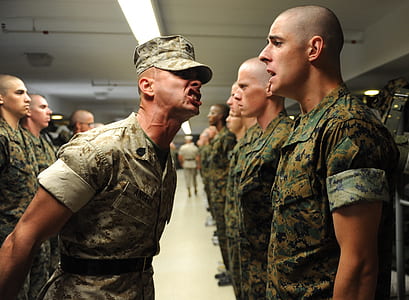 men wearing military uniform standing inside building thumbnail