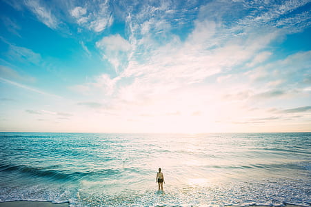 woman standing on seashore thumbnail