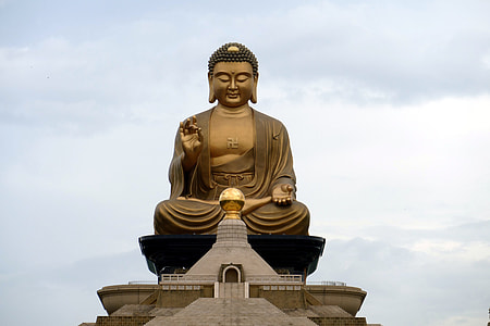 Gautama Buddha shrine under cloudy sky thumbnail