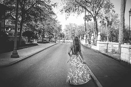 Woman in Floral Dress Standing on Road thumbnail