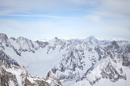 mountains filled with snow during daytime thumbnail