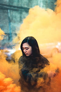 woman in black jacket with yellow and orange smog thumbnail