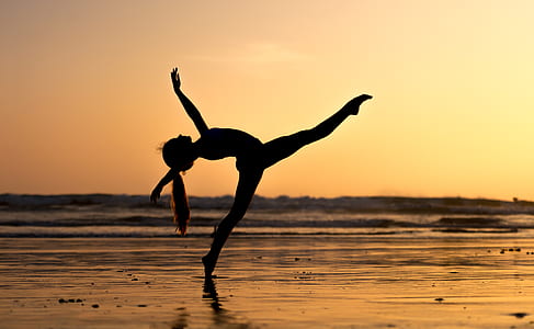 woman doing ballerina pose near sea thumbnail