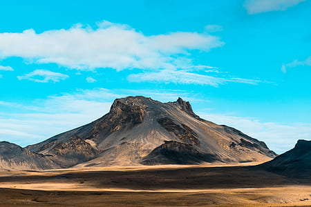 brown mountain near sand thumbnail