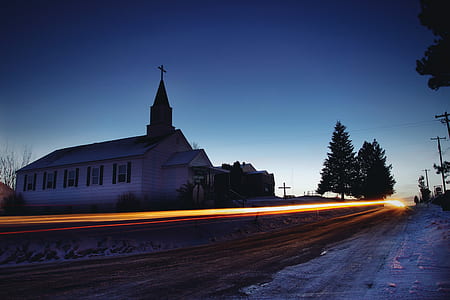 time lapse photo of cathedral beside road thumbnail