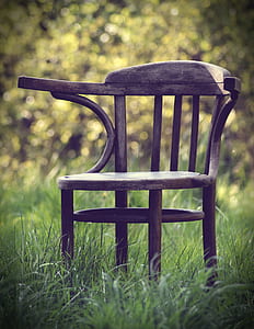 brown wooden armless chair at daytime thumbnail