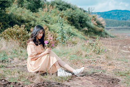 Woman in Brown Dress Under Sunny Sky thumbnail