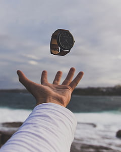watch over hand in selective focus photography thumbnail