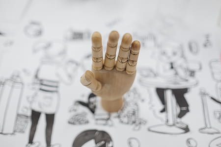 selective focus photography of puppet hand thumbnail