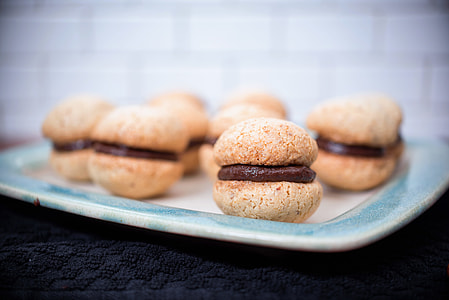 selective focus photography of round pastries on blue ceramic plate thumbnail