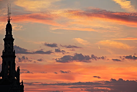 silhouette of black castle under cloudy sky thumbnail