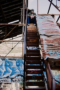man sitting on staircase thumbnail