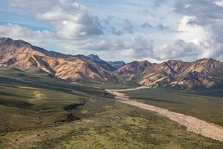 photography of brown and black mountains at daytime thumbnail