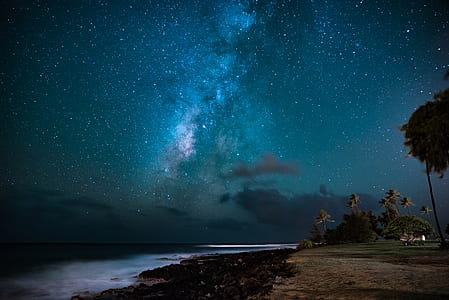 body of water below starry sky thumbnail