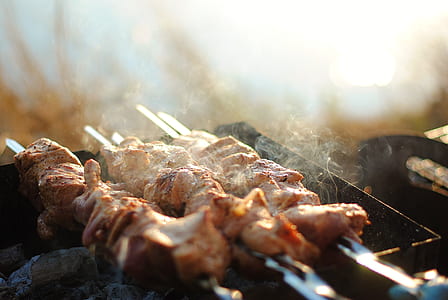 closed up photo of skewered meat on grill thumbnail