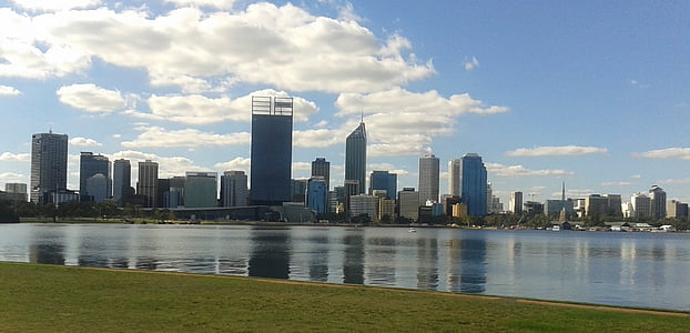 body of water beside city skyline at daytime thumbnail