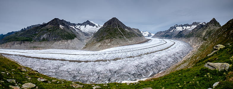rocky alp mountains surrounded by snow thumbnail