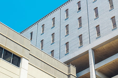 gray and brown concrete building low-angle photo thumbnail