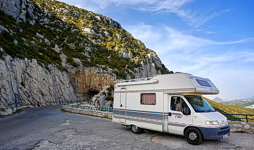 parked camper trailer near mountain thumbnail