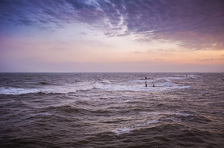 landscape photography of splashing waves in the ocean during golden hour thumbnail