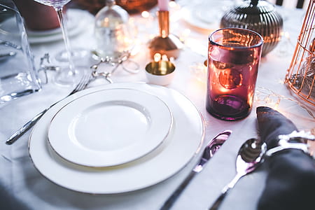 round white ceramic plate beside gray stainless steel knife and spoon thumbnail