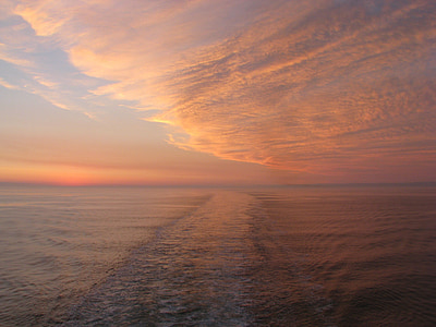 silhouette photography of body of water at golden hour thumbnail
