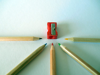 several colored pencils near red sharpener thumbnail