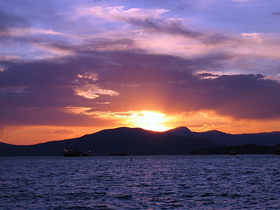 ocean near mountain at sunset thumbnail