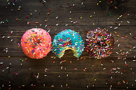 three assorted doughnuts with sprinklers thumbnail