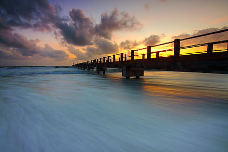 Wooden Pier on Ocean Waves thumbnail