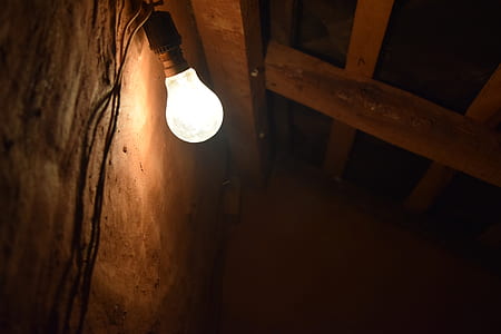 light bulb on beige wall thumbnail