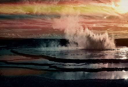 water geyser under cloudy sky thumbnail