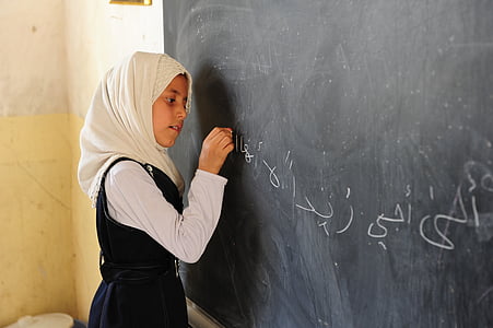 girl writing on chalkboard thumbnail